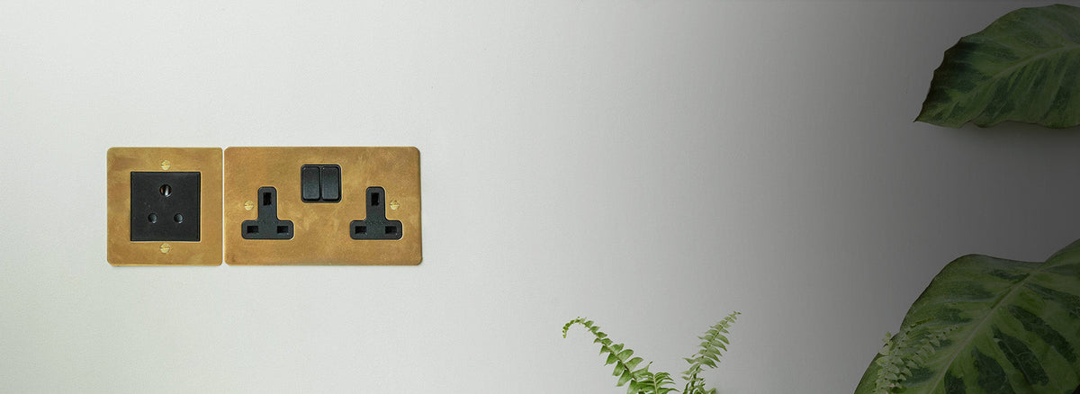 Antique Brass black fan isolator switch above 1G toggle 1G dimmer light switch to the right of curtis door hinge pair